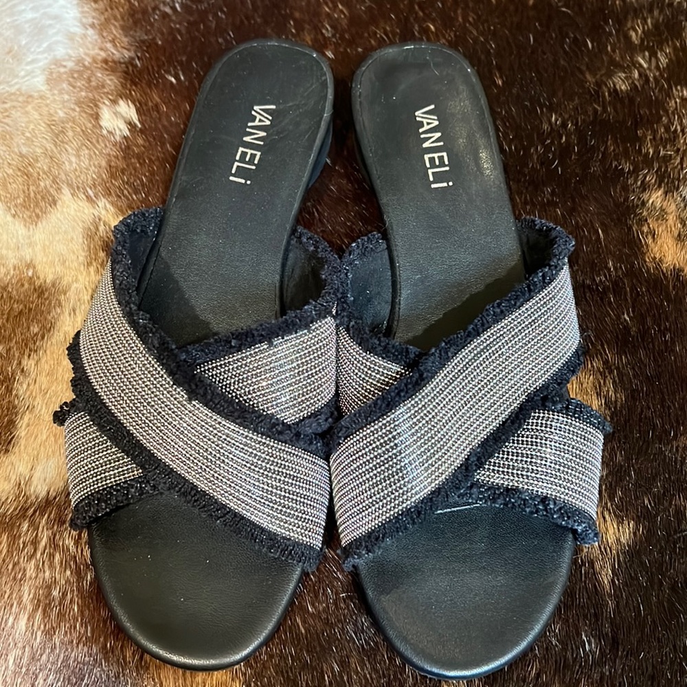 VanEli (Vaneli) flat black frayed and silver metal slip on sandals.